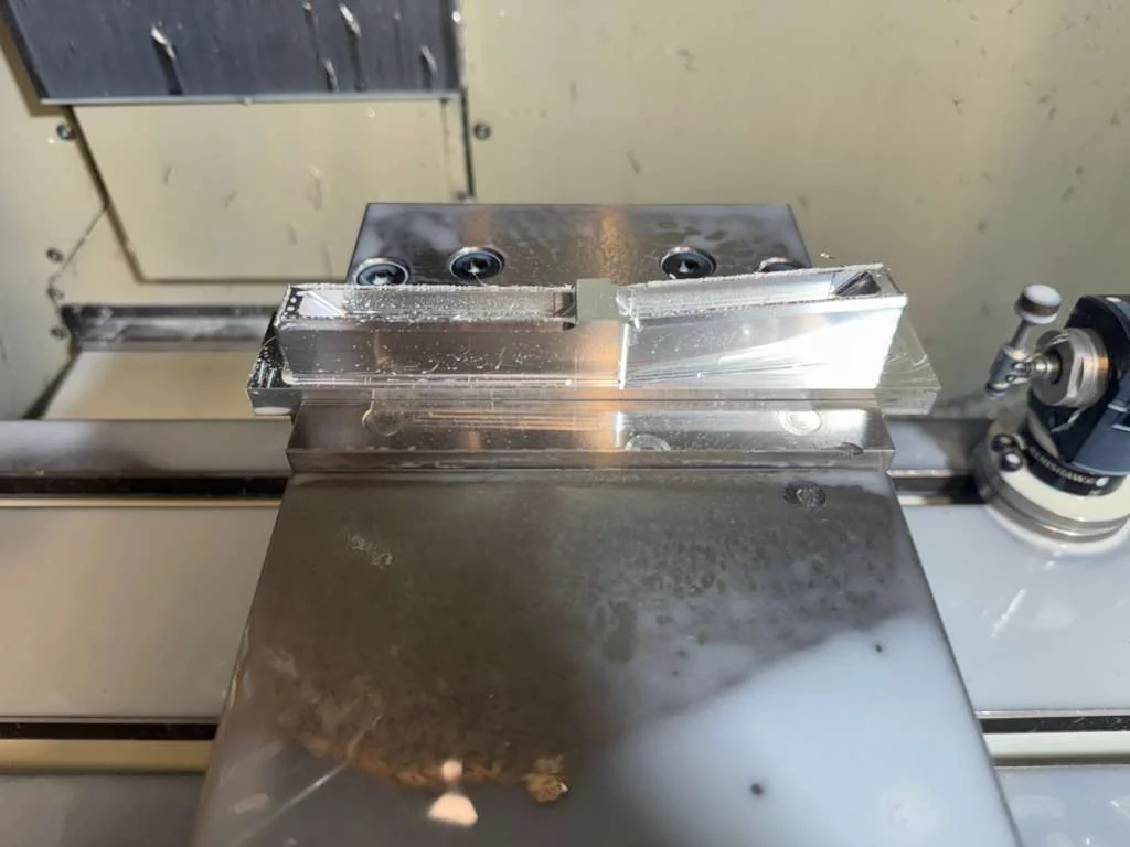 A machined ICAV SPI component held in the workshop mill