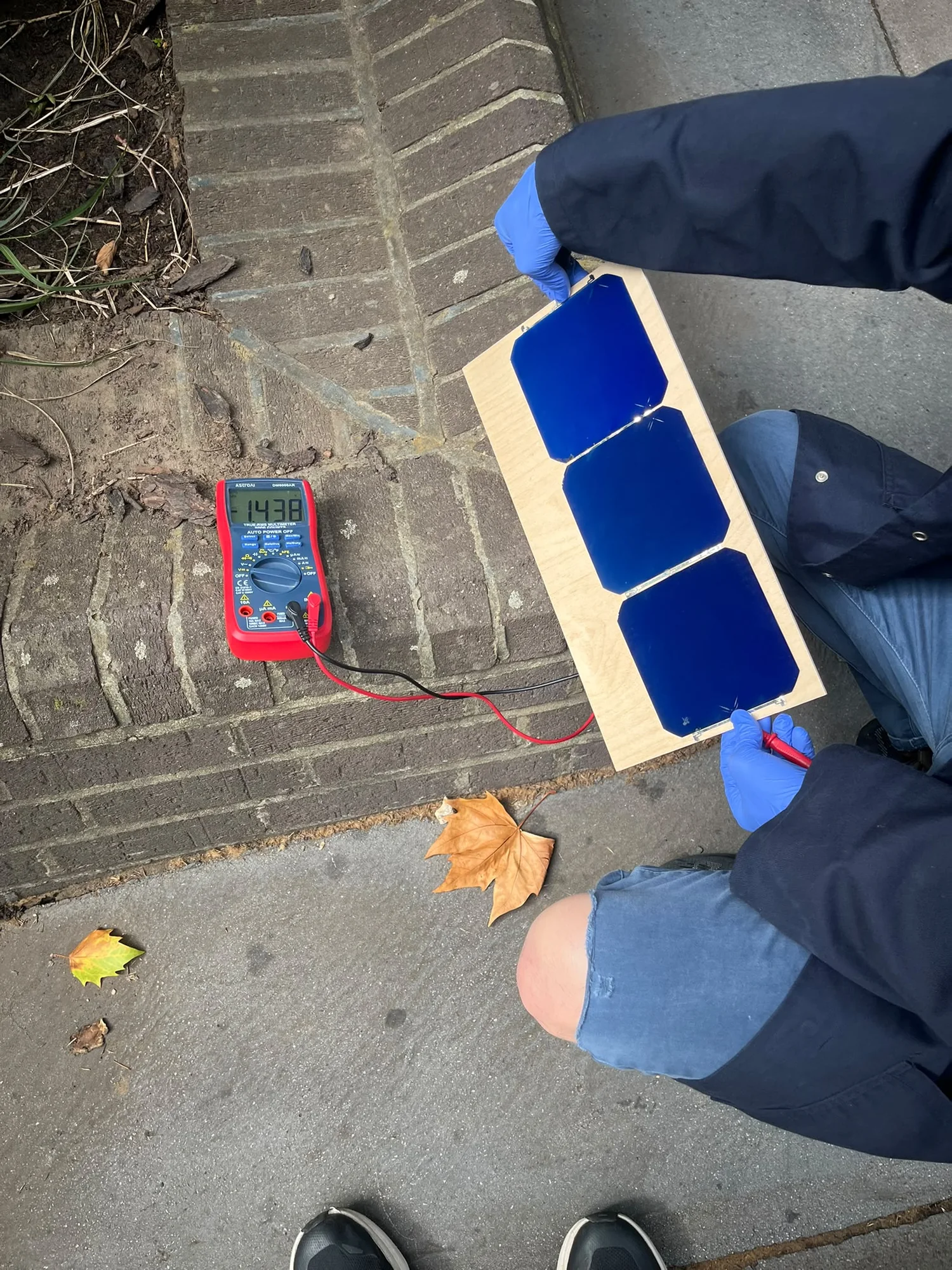 ICAV SPI solar cells connected to a multimeter for an outdoor test